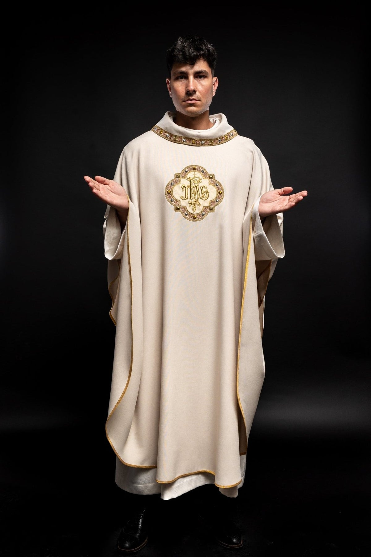 Ecru chasuble full front view with IHS embroidery and edged trim