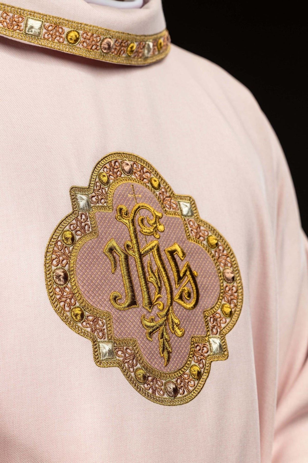 Rose chasuble IHS embroidery and collar trim close-up