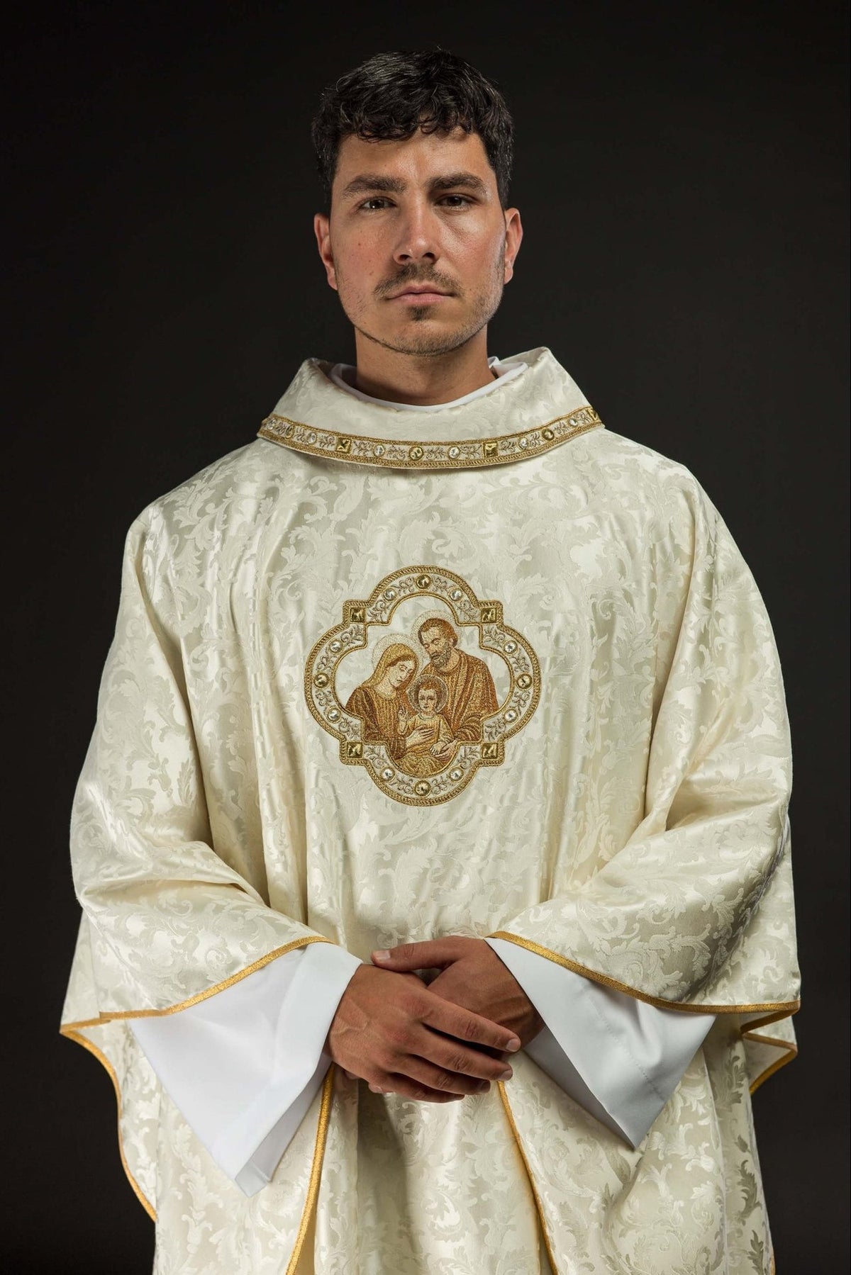 Christmas chasuble front view with Holy Family embroidery, ivory fabric and gold edging