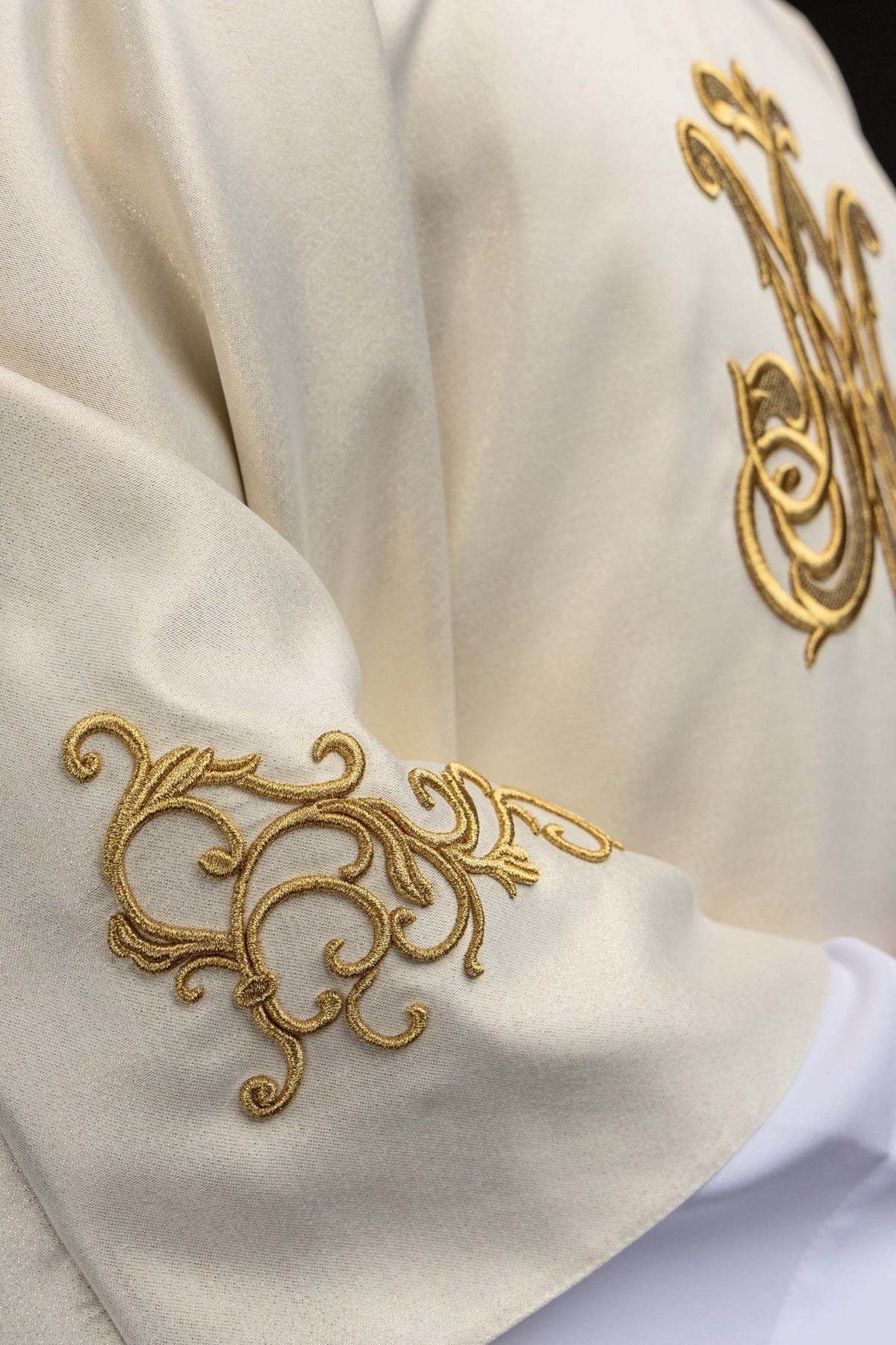 Marian chasuble detail of ecru fabric and Marian symbol embroidery