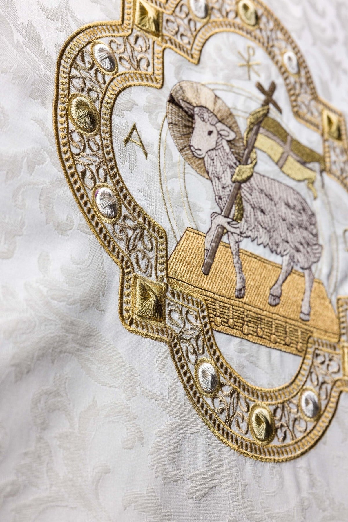 Church lectern cover side close-up showing ornate Agnus Dei embroidery