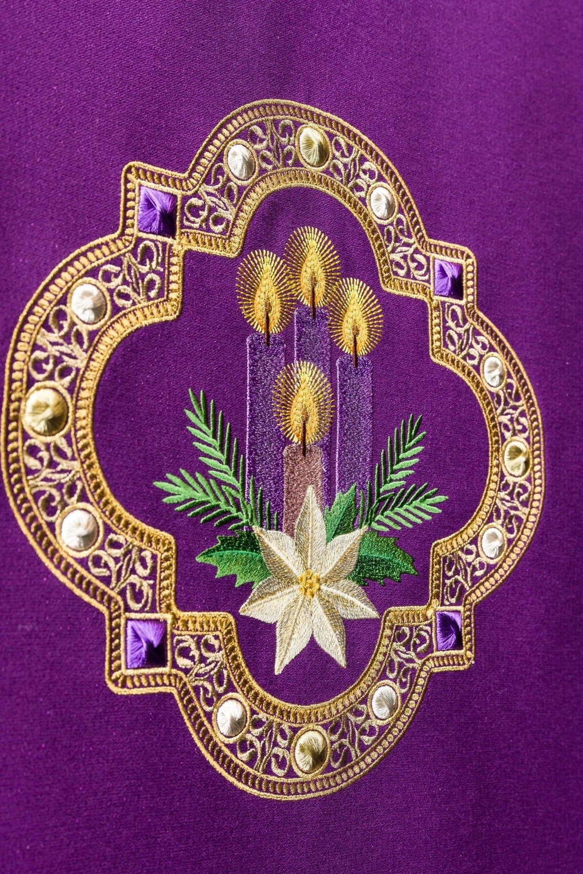 Purple church lectern cover close-up of Advent embroidery with candles and poinsettia