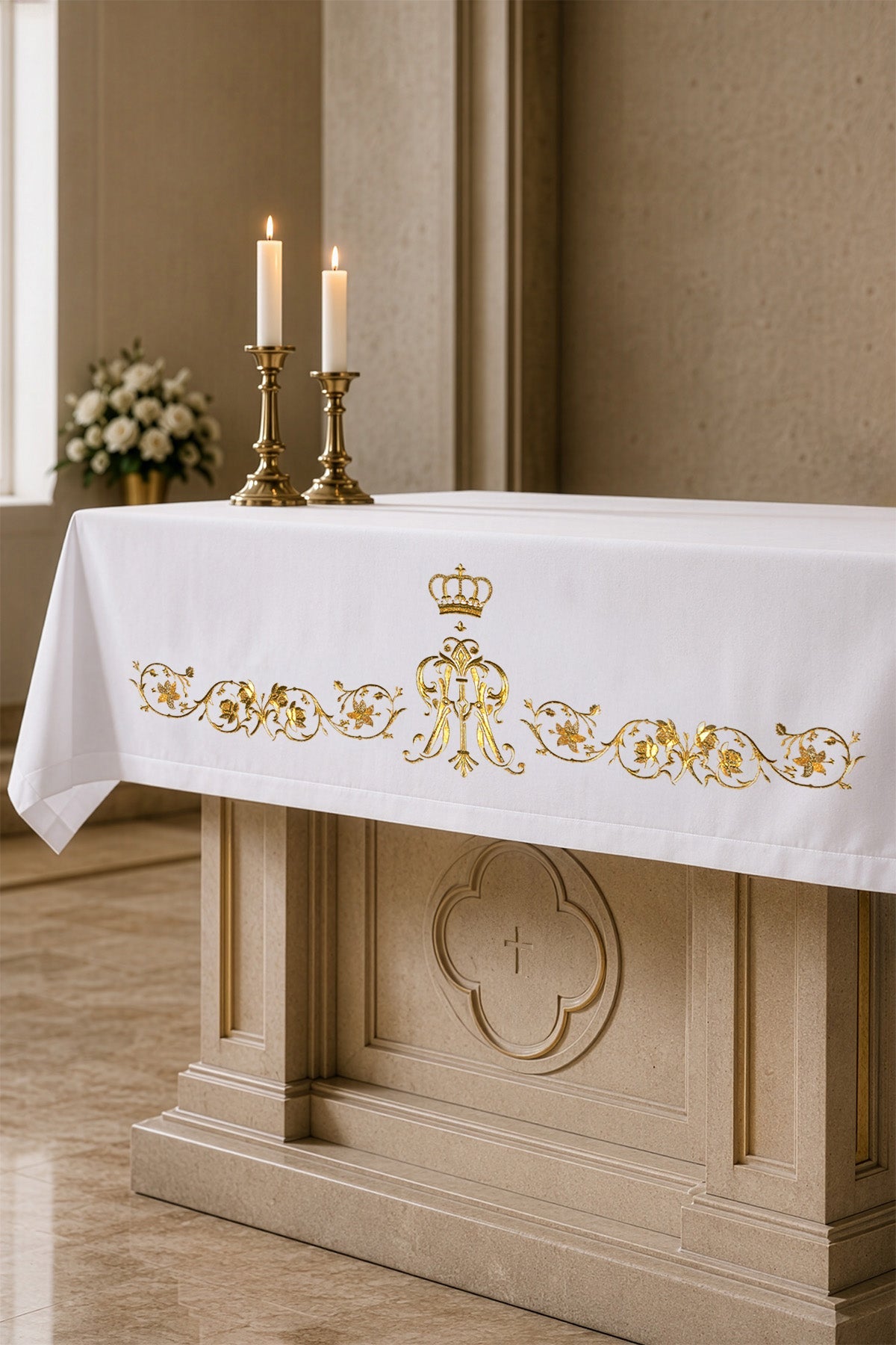 Altar Cloth with an Embroidered Marian Symbol, white with gold embroidery, shown on an altar